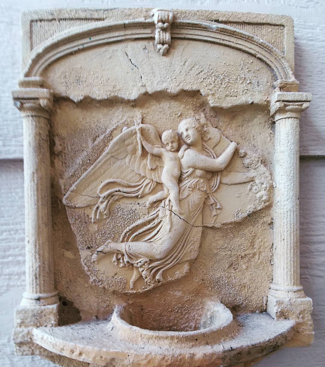 Sigh. This lovely, faded, chipped, ashy font featuring Amor carrying Cupid has enchanted my back porch for years...it reminds me of the Hypnerotomachia Poliphili... #hypnerotomachiapoliphili